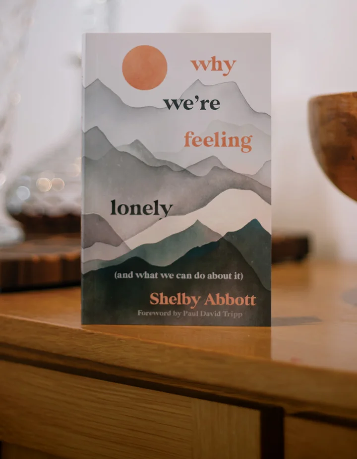 Photograph of Why We're Feeling Lonely on a wooden table