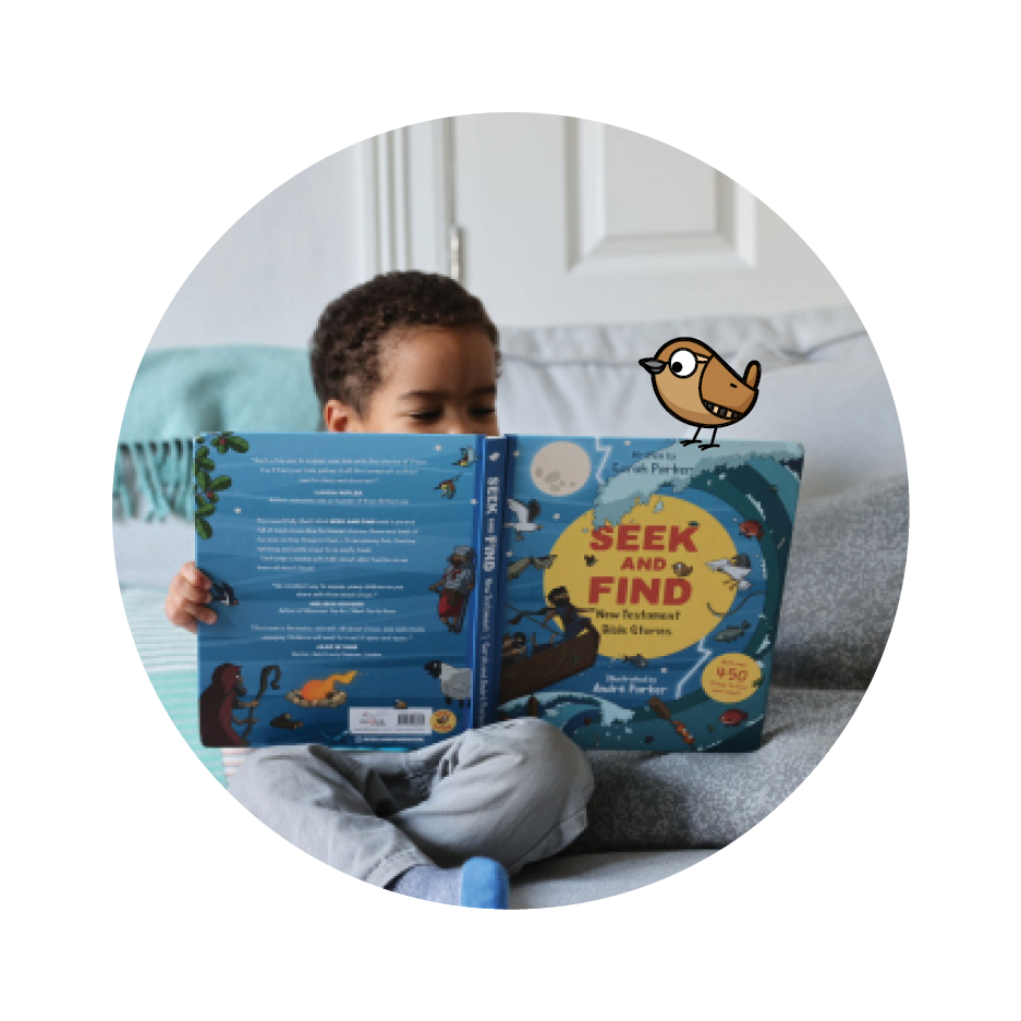 photo of boy reading Seek and Find: New Testament with an illustrated bird on the top of the book