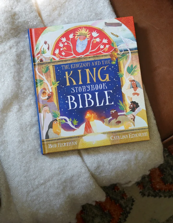 Photograph of The Kingdom and the King Storybook Bible on a blanket